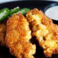 Bacon Mac & Cheese Balls · House-made bacon Mac and cheese balls breaded with panko and served with Tapatio ranch for d...