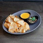 Chips & Dips · Queso and salsa fresca with warm tortilla chips..