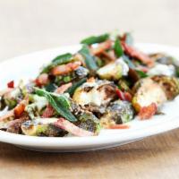 Crispy Brussels Sprouts · Tossed with balsamic vinaigrette, bacon, shaved parmesan and fried sage.