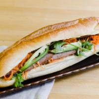 BBQ Pork Banh Mi Sandwich · Comes with mayo, pate, cilantro, pickled carrots, jalapenos and cucumbers.