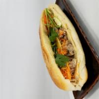 Pork Banh Mi Sandwich · Comes with mayo, pate, cilantro, pickled carrots, jalapenos and cucumbers.