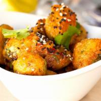Thai Chili Brussels Sprouts · Crispy, crunchy breaded Brussels sprout halves tossed in sweet and spicy Thai chili sauce an...