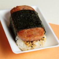 Garlic Spam Musubi · Grilled Spam glazed with garlic sauce on top of sushi rice, wrapped in Nori seaweed