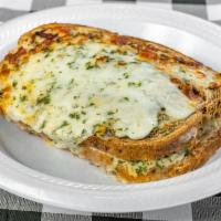 Our Signature Croque Monsieur Sandwich · A delicious sandwich made of ham, melted mozzarella cheese, Alfredo sauce, and baked with gr...
