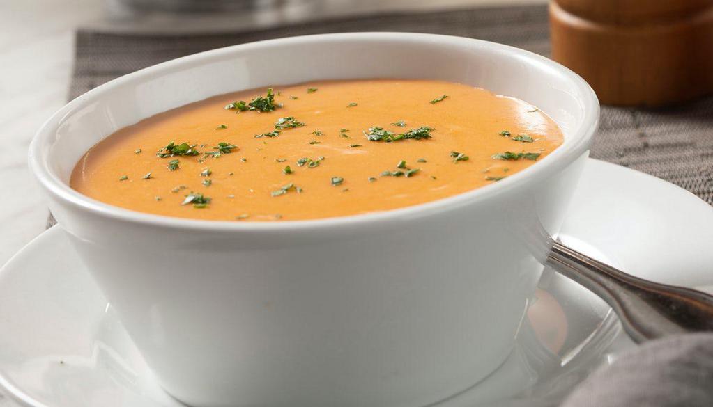 Lobster Bisque · A light cream lobster bisque with a touch of sherry

