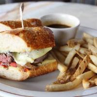 DANIEL'S STEAK SANDWICH · USDA Prime filet mignon, caramelized onions, roasted red peppers, Gruyére cheese, Schwartz B...