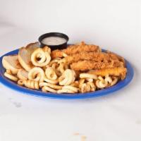 Chicken Tenders · Best tenders in town! Fresh hand-breaded tenders served with curly fries, cream gravy, and g...