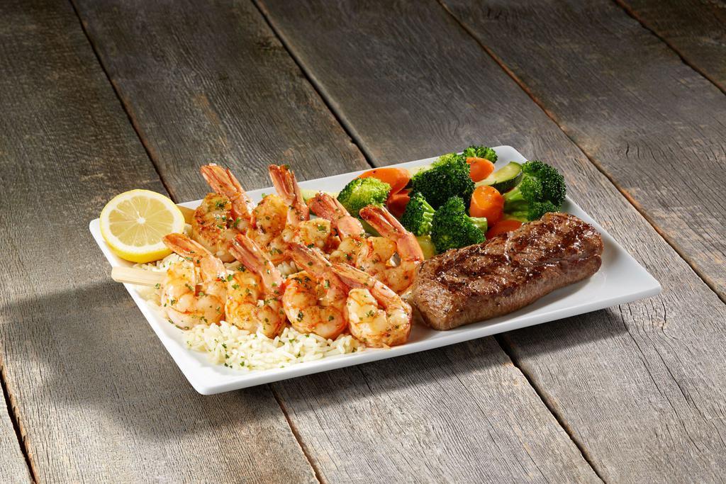 Steak & Grilled Shrimp Skewers · 6 oz. Certified Angus Beef Sirloin & 2 all natural, wild caught jumbo shrimp skewers served over cilantro lime rice, and choice of side.
