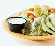 Garden Salad · Fresh iceberg lettuce, cucumbers, tomatoes, carrots, our cheese blend, seasoned croutons, an...