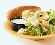 Caesar Side Salad  · Crisp romaine lettuce, shaved Parmesan, and seasoned croutons with a traditional Caesar dres...