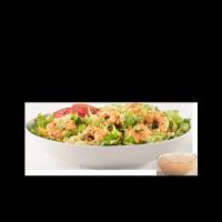 IT'S BACK! CAJUN SHRIMP SALAD · seasoned shrimp, dirty rice, cheddar, tomato and green onions on a bed of romaine with cream...