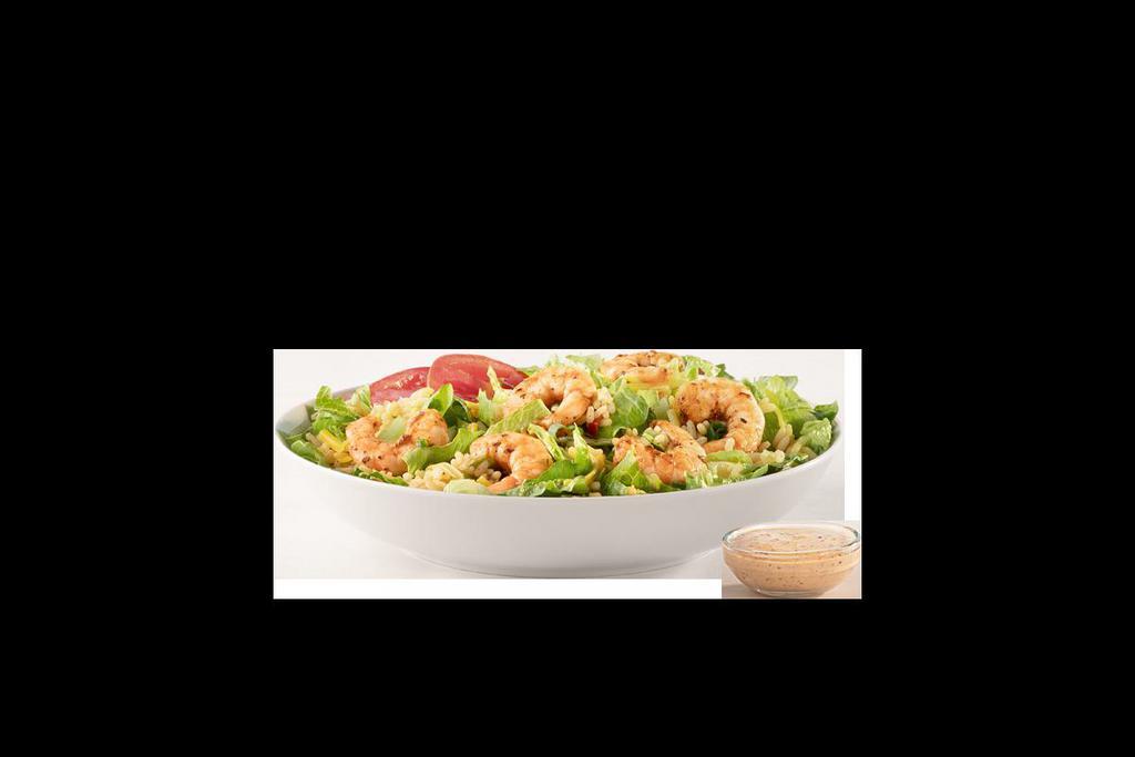IT'S BACK! CAJUN SHRIMP SALAD · seasoned shrimp, dirty rice, cheddar, tomato and green onions on a bed of romaine with creamy creole dressing on the side. 440 calories. Served with a side.