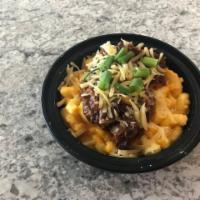 Donnie's Mac · Macaroni & Cheese topped with Kansas City sweet BBQ Pork, smoked white cheddar cheese and gr...