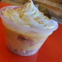 Banana Pudding · Creamy banana pudding layered with vanilla wafer bits whipped cream and magic mix.