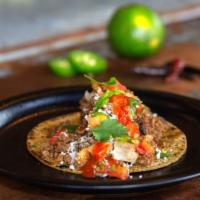 Chorizo Taco · Chorizo, refried Black Beans, queso, pico de gallo, radish.