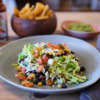 Oaxaca Salad. · Green salad with beans, guacamole, crema, & your choice of barbacoa, pollo, or carnitas.