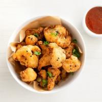 crispy cauliflower · serves 2 | tempura battered cauliflower topped with sesame seeds and green onions. includes ...