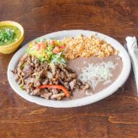 Fajitas Plate  · Sizzling beef or chicken fajitas served with rice, beans, guacamole and tortillas. Add shrim...