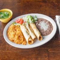 Chicken Flautas  · 2 flautas served with lettuce, tomatoes and cheese. Add rice and beans for an additional cha...