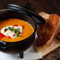 Tomato Bisque · Roasted tomato, spiced cream, Gruyere and Fontina grilled cheese.