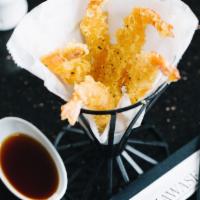Shrimp Tempura · 5 pieces of shrimp lightly battered deep-fried with vegetable oil, served with tempura sauce.
