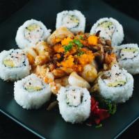 Dynamite Roll · California roll topped with crawfish, scallop, mushroom and onion baked with mayo. Served wi...