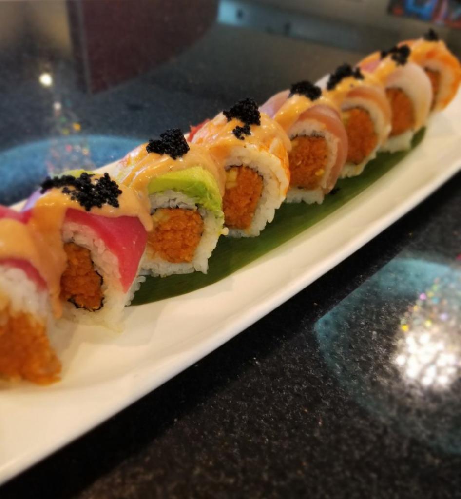 Scorpion Roll · Spicy yuna roll topped with Ahi Tuna, salmon, red snapper, albacore, shrimp, avocado, and black caviar. Served with spicy mayo.