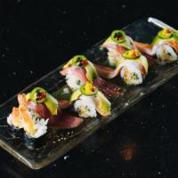 Sensation Roll · Shrimp tempura, cucumber and seasoned rice inside topped with Ahi Tuna, salmon belly, avocad...
