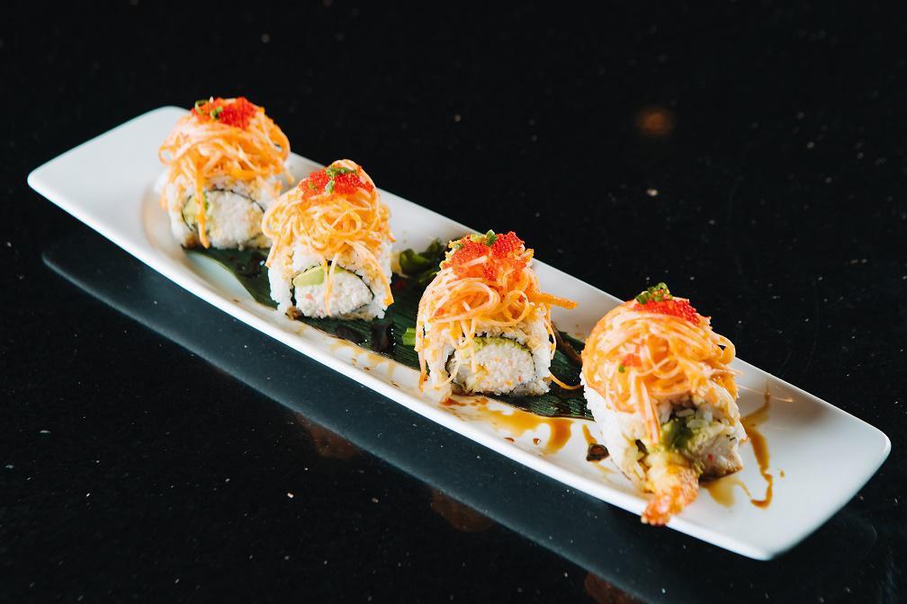 Red Dragon Roll · Shrimp tempura, crab meat and avocado inside topped with shredded crab stick mixed with spicy Sriracha sauce and red caviar. Served with sweet eel sauce. Spicy.