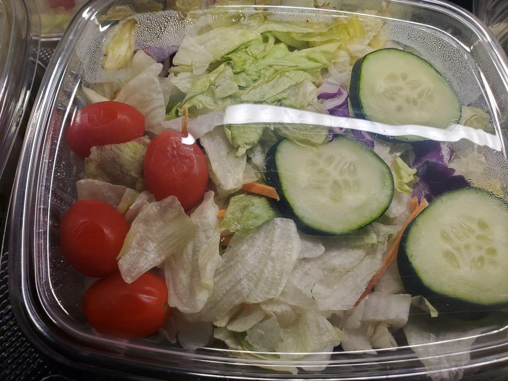 Salad  · Fresh salad with a variety of green vegetables typically served on a bed of lettuce. 
