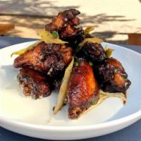 Jerk Chicken Wings · Jumbo Chicken Wings marinated and tossed with house jerk dressing, shaved celery, and herbs....