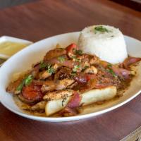 Pollo Saltado · Chicken sauteed in olive oil, white wine, red onions, tomatoes and fresh herbs.