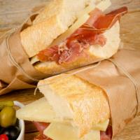 Iberico Sandwich · Serrano ham, manchego cheese and red pepper.