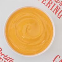 Cheese Sauce for 5 · Our famous cheese sauce served family-style. Enough for the French Fry Fast Pack or Onion Ri...