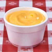 Cheese Sauce · A side of our famous cheese sauce, paired best with fries and onion rings.