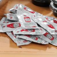 Ketchup Packets · Ketchup packets on the side.