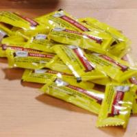 Mustard Packets · Yellow mustard packets.