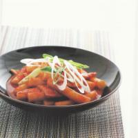 Spicy Rice Cake · Rice cake, fishcake, and vegetable mixed with spicy creamy sauce. Add ramen for an additiona...