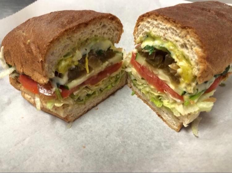The Veggie Sub · Sauteed onions and peppers, banana peppers, cucumbers, lettuce, tomatoes, fresh avocado, provolone and crumbled goat cheese.
