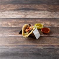 Steak Tacos · Served with lettuce and tomato on a soft corn tortilla.