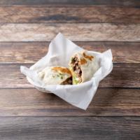 Steak Burrito · Served with beans, lettuce, tomato, cheese and sour cream.