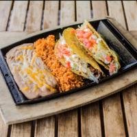 American Tacos · Soft or crunchy tortillas filled with seasoned ground beef, Cheddar & Jack cheese, shredded ...