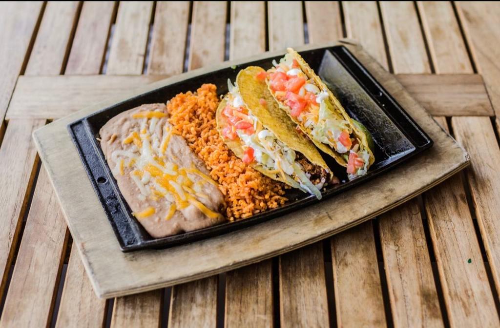 American Tacos · Soft or crunchy tortillas filled with seasoned ground beef, cheddar & Jack cheese, shredded lettuce, tomatoes, and sour cream.