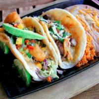 Surf and Turf Taco Combo · Beer battered lobster taco and grilled filet mignon taco. Served with Mexican rice and refri...