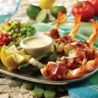 Bacon Wrapped Camarones · Six jumbo shrimp stuffed with Monterey Jack and fresh jalapeño, bacon wrapped, and mesquite ...