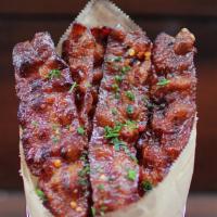 Bacon Candy · Bacon baked with brown sugar, crushed red pepper chili flakes, black pepper.
