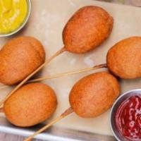 Mini Corn Dogs · Nathan’s All Natural beef hot dogs, corn batter dipped + fried to order, served with our Liq...