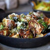 Brussels Sprouts · Lemon, garlic, butter, capers, crispy croutons, Romano cheese. 470 calories.