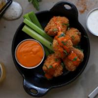 Buffalo Chicken Nuggets · Hand breaded chicken nuggets tossed in Cajun spices, drizzled with High Altitude hot sauce, ...