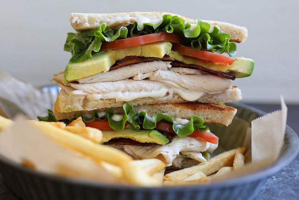 House Club Sandwich · In-house roasted chicken breast, smoked bacon, avocado, lettuce, tomato, mayo, toasted sourdough. Served with your choice of side. 970 calories.